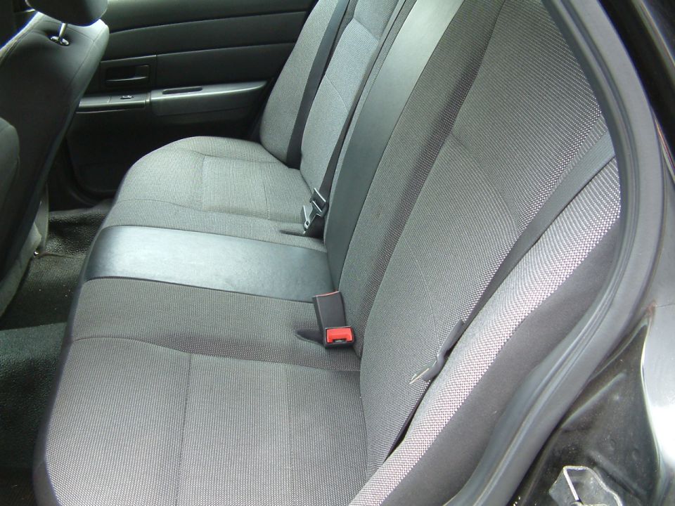 Gray fabric rear seats with black trim and seatbelts