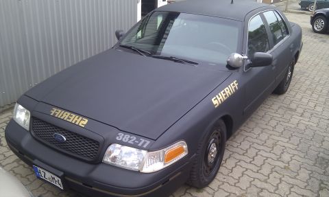 2003 Ford Crown Victoria - This 2003 Ford Crown Victoria is marked as a sheriff vehicle with gold lettering on the hood and door.
