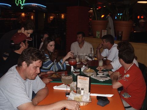 1996 Ford Bronco - A group of friends enjoys a meal and drinks at a lively restaurant.