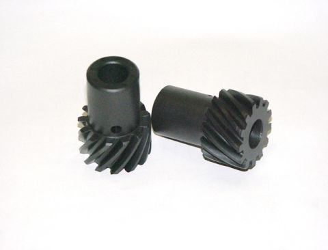 1990 Ford Bronco - Two helical gears are shown against a plain white background.