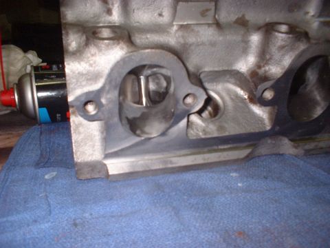 1969 Ford Torino - Close-up view of an engine cylinder head, showing the intake port and gasket mating surface.