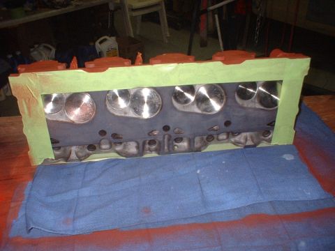 1969 Ford Torino - Engine cylinder head with valves visible, masked with green tape for painting.