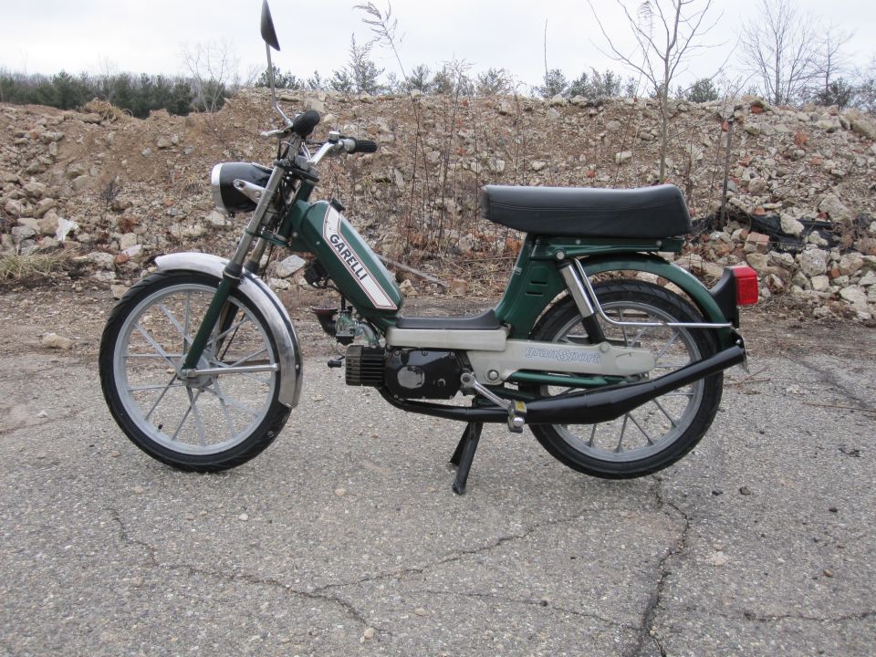Green moped with chrome fenders and exhaust, 'GARELLI' text on tank