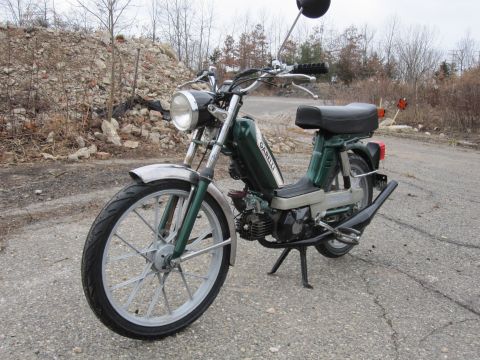 1981 Garelli Rally Sport - Green moped with chrome fenders and 'GARELLI' text on the side panel.