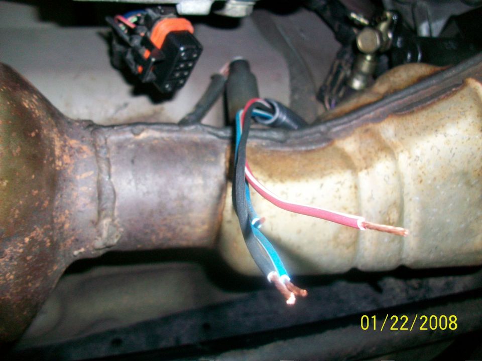 Exhaust pipe with exposed wires and connector