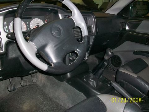 2000 Isuzu Vehicross - Interior view of a 2000 Isuzu Vehicross, the steering wheel, dashboard, and center console.