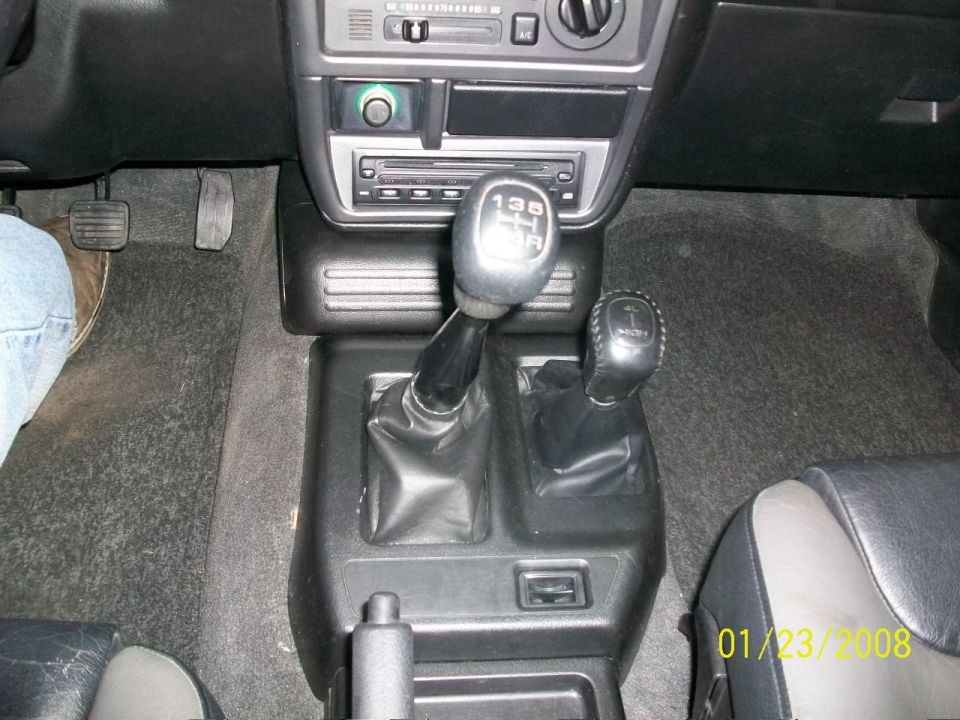 Interior shot showing the center console with two gear shifters and pedals