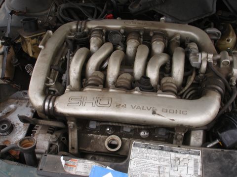 1993 Ford Taurus - Close-up of the 1993 Ford Taurus SHO's 24 valve DOHC engine, showing the intake manifold and other components.