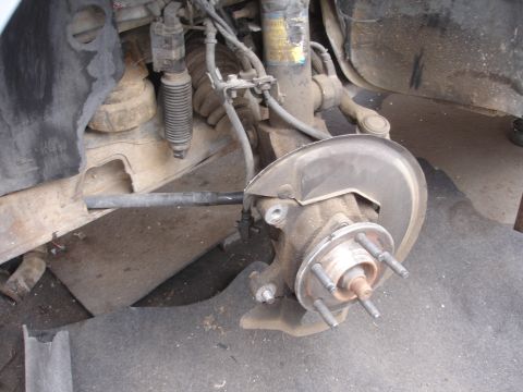 1993 Ford Taurus - Front wheel hub and suspension components visible on a 1993 Ford Taurus.
