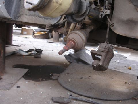 1993 Ford Taurus - This image shows the underside of a vehicle, focusing on the suspension and brake system components.
