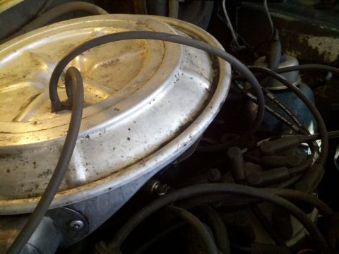 1978 Ford Bronco - Close-up view of engine components, including the air cleaner and spark plug wires, with "SUPERMOTORS" visible at the bottom right.