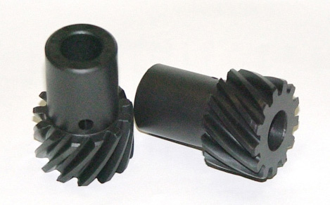 1990 Ford Bronco - Two black helical gears are shown against a white background.