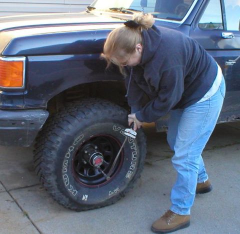 1989 Ford Bronco - 9-29-03. Torqeing lugnuts after repacking wheel bearings.