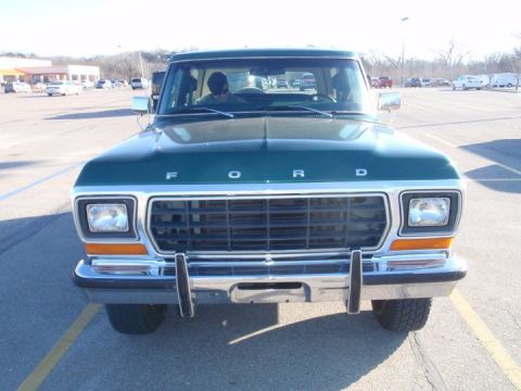 1978 Ford Bronco - Front view of a green 1978 Ford Bronco parked in a lot.