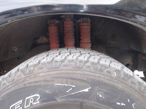 1994 Ford Bronco - The rear suspension components and tire are visible in this close-up shot.