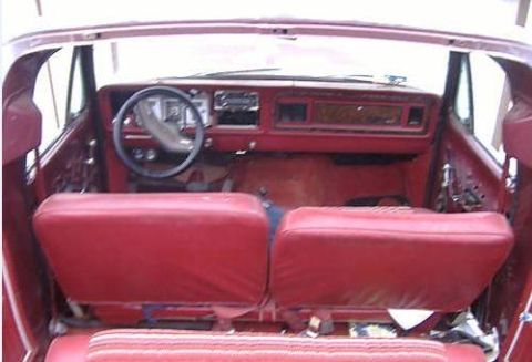 1978 Ford Bronco - Interior view of a 1978 Ford Bronco, showing the red seats and dashboard.