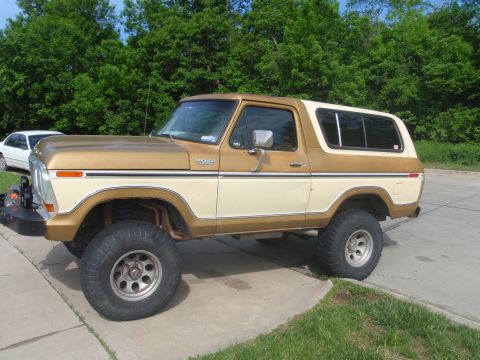 1978 Ford Bronco - Lifted 1978 Ford Bronco in two-tone gold and cream with aftermarket wheels.