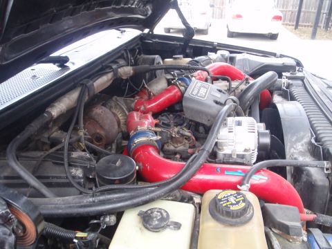 1994 Ford Bronco - Close-up view of a diesel engine's turbocharger and intake system.