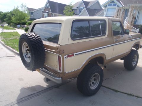 1978 Ford Bronco - This 1978 Ford Bronco features a distinctive two-tone brown and cream exterior with a rear-mounted spare tire.