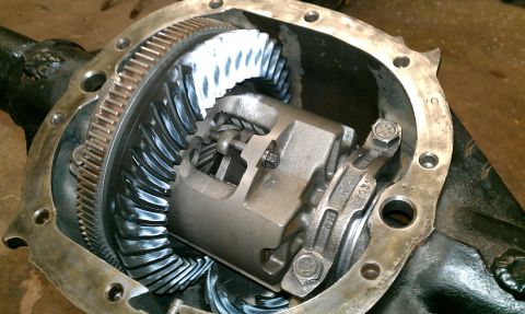 1999 Chevrolet Camaro - Close-up view of a vehicle's differential gears and housing, showing the ring and pinion gears.