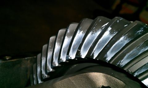 1999 Chevrolet Camaro - A close-up view of a differential gear, showing the teeth and some wear marks.