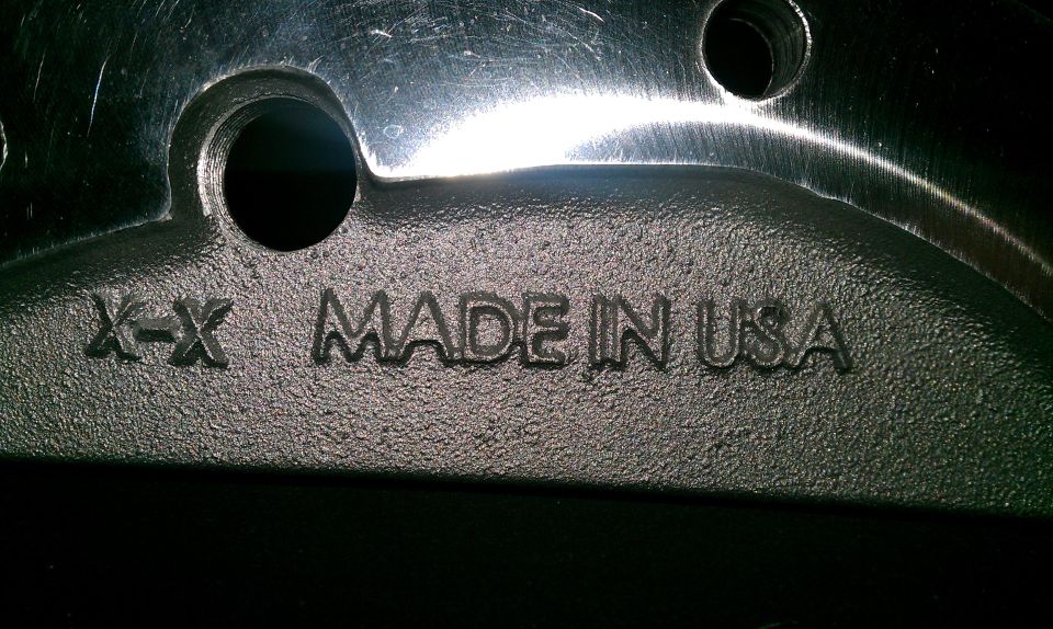 Close-up of a metal part with 'MADE IN USA' stamped on it