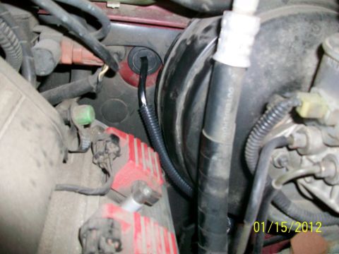 2000 Isuzu Vehicross - Engine bay components including brake booster, hoses, and wiring harness.