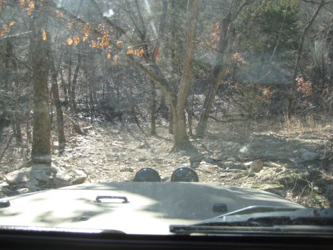 2005 Jeep Wrangler - View from inside a 2005 Jeep Wrangler as it navigates a rocky, wooded path.