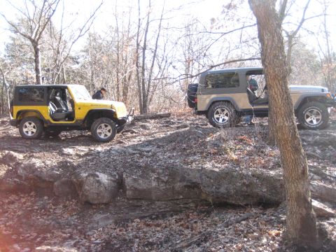2005 Jeep Wrangler - Two Jeep Wranglers navigate a challenging rocky terrain during an off-road excursion.