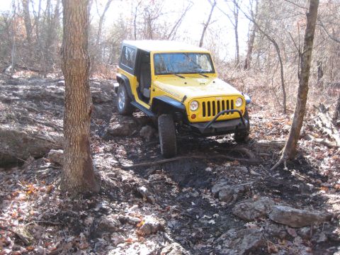 2005 Jeep Wrangler - 2005 Jeep Wrangler Rubicon tackling an off-road trail with rocky terrain.
