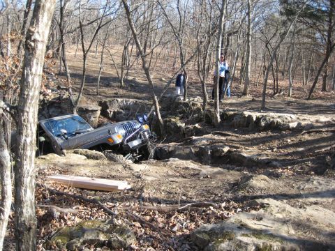 2005 Jeep Wrangler - A Jeep Wrangler navigates a challenging rocky trail, demonstrating its off-road capabilities.