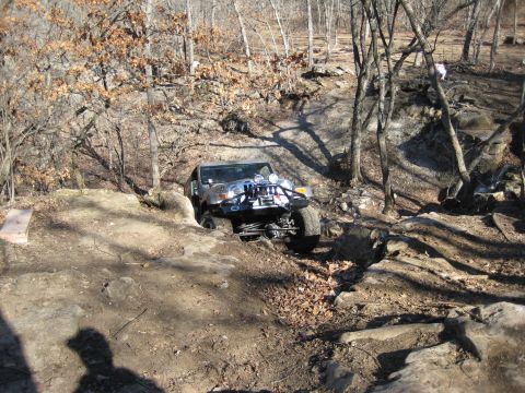 2005 Jeep Wrangler - A Jeep Wrangler tackles a challenging off-road course with steep inclines and rocky terrain.