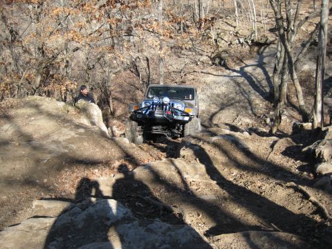 2005 Jeep Wrangler - Jeep Wrangler tackling a challenging rocky trail during an off-road excursion.