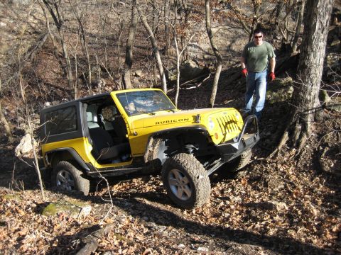2005 Jeep Wrangler - Yellow 2005 Jeep Wrangler Rubicon navigating a rocky, wooded trail.