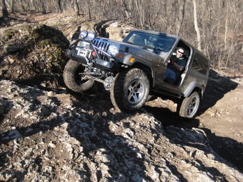2005 Jeep Wrangler - A Jeep Wrangler Rubicon navigates a challenging, muddy, and rocky off-road course.