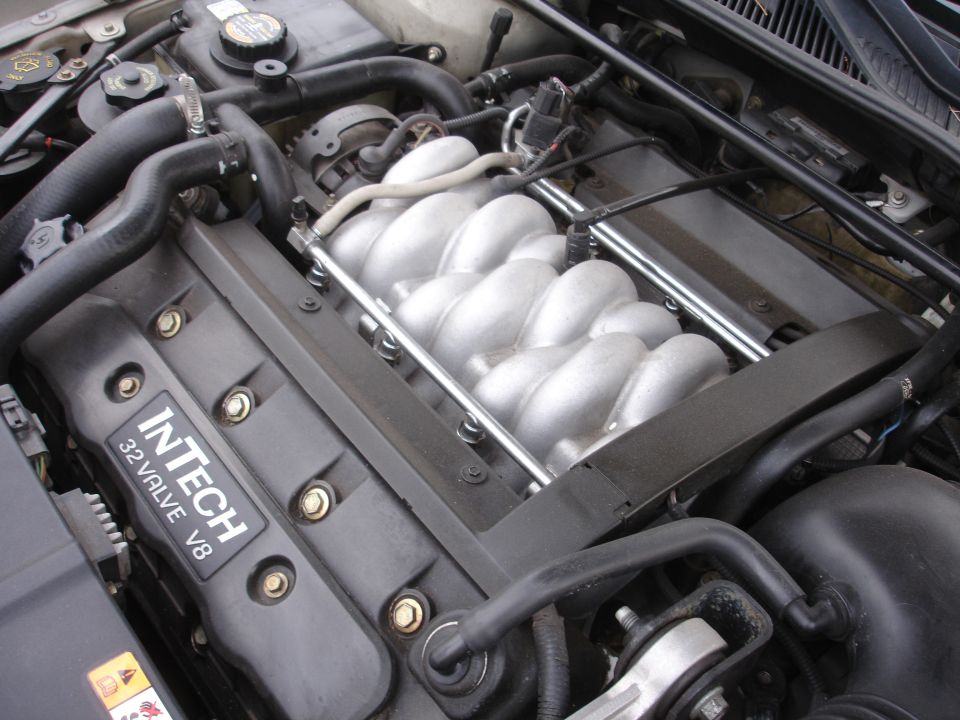 Engine with "InTech 32 Valve V8" visible on a black cover