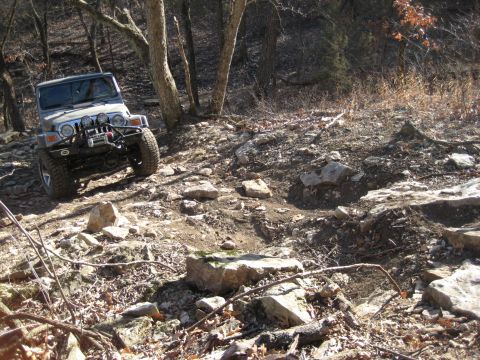 2005 Jeep Wrangler - This Jeep Wrangler is shown off-road on a challenging rocky path.