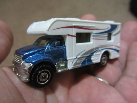 1968 Ford Mustang - This toy RV features a blue cab and a white camper body with decorative graphics.