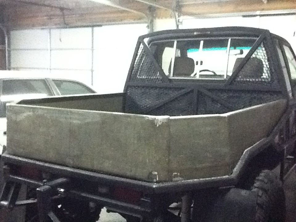 Truck bed with custom cage and flatbed insert