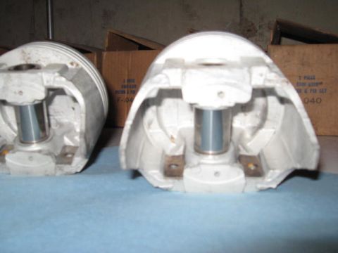1963 Ford Galaxie - Two pistons are shown in detail, with cardboard boxes visible in the background.
