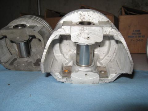 1963 Ford Galaxie - Engine pistons shown in detail, with part numbers visible on a box in the background.