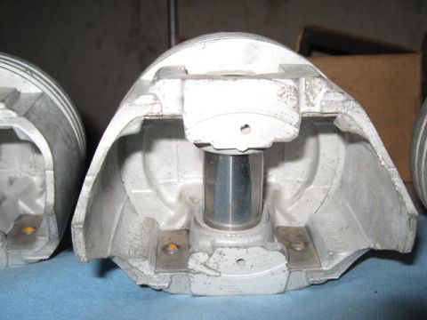 1963 Ford Galaxie - These cutaway pistons show internal components and mounting points for connecting rods.