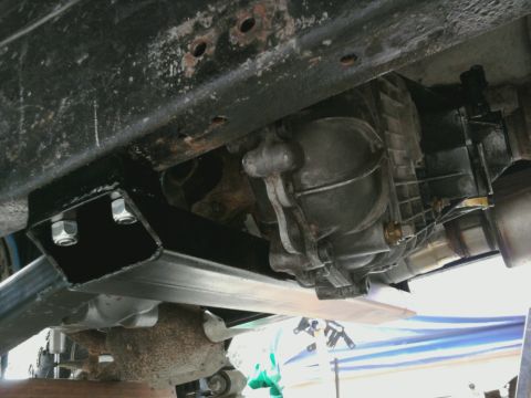 1995 Ford Bronco - Underside view of vehicle's drivetrain components, including transmission and transfer case.