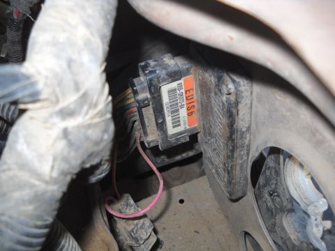 1992 Ford Explorer - Close-up of an engine control module and associated wiring harness.