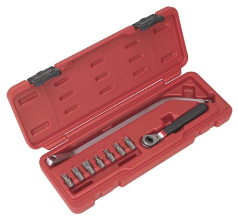 1990 Ford Bronco - A red case contains a specialized wrench set designed for automotive door hinges.