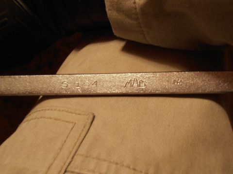1990 Ford Bronco - A close-up view of a MAC brand wrench with markings indicating its size and origin.