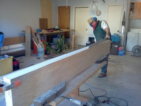 1996 Ford Bronco - A person is working on a woodworking project in a garage setting.