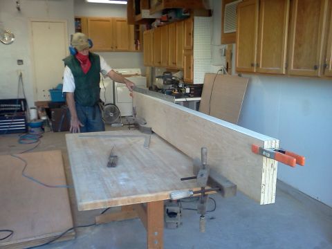 1996 Ford Bronco - A person is engaged in woodworking in a garage setting, with tools and materials visible.