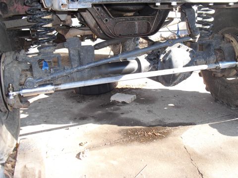 1986 Ford Bronco - Undercarriage view showing steering and suspension parts of a vehicle.