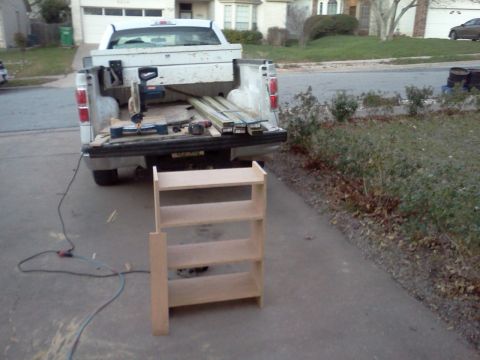 1996 Ford Bronco - Tools and lumber are staged in the bed of a pickup truck for a project.